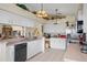 Kitchen offers ample counter space, stainless steel appliances, and white cabinets at 2263 Whisper Walk Dr, Spring Hill, FL 34606