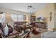 Living Room with comfortable seating, a large TV, and a vaulted ceiling at 2263 Whisper Walk Dr, Spring Hill, FL 34606