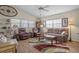 Living Room features leather armchairs, a sofa, and a coffee table at 2263 Whisper Walk Dr, Spring Hill, FL 34606