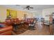 Living Room features comfortable leather sofas and a tile floor at 2263 Whisper Walk Dr, Spring Hill, FL 34606