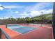 Two well-maintained pickleball courts with surrounding fencing at 2263 Whisper Walk Dr, Spring Hill, FL 34606