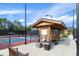 Covered seating and water fountain near pickleball courts at 2263 Whisper Walk Dr, Spring Hill, FL 34606