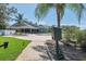Community pool with a walkway and green space at 2263 Whisper Walk Dr, Spring Hill, FL 34606
