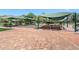 Outdoor shuffleboard area with shade structures at 2263 Whisper Walk Dr, Spring Hill, FL 34606