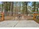 Metal entrance gate leading to a long private driveway at 23089 Grubbs Rd, Brooksville, FL 34601