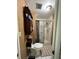 A full bathroom featuring a toilet, shower, and a small vanity with cabinet and towels at 30 Turner St # 208, Clearwater, FL 33756