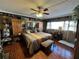 This bedroom features a large bed with unique animal print bedding, ceiling fan, and natural light at 30 Turner St # 208, Clearwater, FL 33756