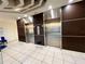 Modern stainless steel elevators in a well-maintained common area at 30 Turner St # 208, Clearwater, FL 33756