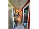 Hallway with tiled flooring, colorful walls, and nautical-themed decorations at 30 Turner St # 208, Clearwater, FL 33756