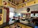 Bright living room featuring eclectic decor, yellow walls, and an open layout with a view at 30 Turner St # 208, Clearwater, FL 33756
