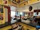 A living room with unique decor, opening to a balcony with an inviting outdoor view at 30 Turner St # 208, Clearwater, FL 33756