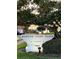 Prominent signage for Harbor Oaks Place at 30 Turner Street, surrounded by landscaping and mature trees at 30 Turner St # 208, Clearwater, FL 33756