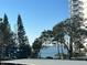 Scenic view of the water from a high-rise building with lush greenery and blue skies at 30 Turner St # 208, Clearwater, FL 33756
