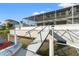 Home with dock and ramp provide easy access to the water, plus screened patio views at 4034 Cobia Dr, Hernando Beach, FL 34607