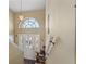 Interior shot of staircase leading upstairs with railing and light colored walls at 4034 Cobia Dr, Hernando Beach, FL 34607