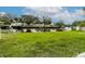 Expansive green backyard with waterfront canal and boat docks at 5648 Riverview Dr, New Port Richey, FL 34652