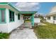 Covered carport area with view of the backyard and neighboring houses at 5648 Riverview Dr, New Port Richey, FL 34652