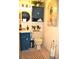 Small bathroom with navy vanity and checkered floor at 6124 Chesham Dr # 6, New Port Richey, FL 34653