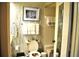 Bathroom with patterned wallpaper, toilet and bathtub at 6124 Chesham Dr # 6, New Port Richey, FL 34653