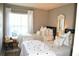 Bedroom with two twin beds, window, and chair at 6124 Chesham Dr # 6, New Port Richey, FL 34653