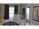 Bedroom with dresser, large window, and gray accents at 6124 Chesham Dr # 6, New Port Richey, FL 34653