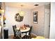Small dining area with a round table set for four, featuring stylish decor at 6124 Chesham Dr # 6, New Port Richey, FL 34653