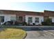 Front view of a condo building showcasing its neat landscaping and parking area at 6124 Chesham Dr # 6, New Port Richey, FL 34653