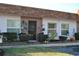 Well-maintained condo building with attractive landscaping and individual unit entrances at 6124 Chesham Dr # 6, New Port Richey, FL 34653