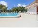 Refreshing community pool with lounge chairs at 6124 Chesham Dr # 6, New Port Richey, FL 34653