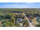 Aerial view of the home nestled amongst trees, showcasing the property and the surrounding landscape at 7482 Winter St, Brooksville, FL 34613
