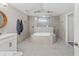 Open and elegant bathroom with soaking tub, standalone shower, and double vanity at 7482 Winter St, Brooksville, FL 34613