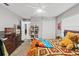 Bedroom showcasing bright, natural light with a ceiling fan and nice closet space at 7482 Winter St, Brooksville, FL 34613