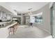 Open kitchen and dining area with a large window that overlooks the pool and outdoor space at 7482 Winter St, Brooksville, FL 34613