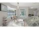 Bright eat-in kitchen features a glass table near the pool with marble countertops at 7482 Winter St, Brooksville, FL 34613