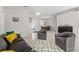 A living room featuring tile floors, neutral-colored walls, and comfortable seating arrangements at 7482 Winter St, Brooksville, FL 34613