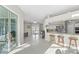Bright open floor plan connecting the living area, dining space, and kitchen with lots of natural light at 7482 Winter St, Brooksville, FL 34613
