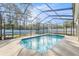 Inviting screened-in swimming pool perfect for cooling off on hot summer days at 7482 Winter St, Brooksville, FL 34613