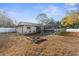 Private backyard featuring a fire pit and pool at 7489 Gates Cir, Spring Hill, FL 34606