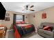 Bedroom with a double bed, ceiling fan, and Cleveland Browns decor at 7489 Gates Cir, Spring Hill, FL 34606