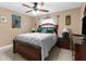 Cozy bedroom with a double bed, ceiling fan, and a TV at 7489 Gates Cir, Spring Hill, FL 34606
