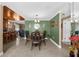 Bright dining room with a wood table and green walls at 7489 Gates Cir, Spring Hill, FL 34606