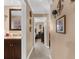 Clean hallway with light walls and tiled floors at 7489 Gates Cir, Spring Hill, FL 34606