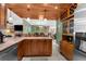 Eat-in kitchen with granite countertops and ample cabinet space at 7489 Gates Cir, Spring Hill, FL 34606