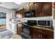 Functional laundry room with washer, dryer, and extra counter space at 7489 Gates Cir, Spring Hill, FL 34606
