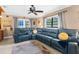 Comfortable living room with a spacious sectional sofa and access to patio at 7489 Gates Cir, Spring Hill, FL 34606