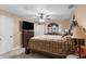 Spacious main bedroom with king-size bed and flat-screen TV at 7489 Gates Cir, Spring Hill, FL 34606