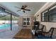 Inviting pool area with patio furniture and screened enclosure at 7489 Gates Cir, Spring Hill, FL 34606