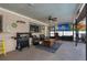 Relaxing screened patio with seating, grill, and outdoor furniture at 7489 Gates Cir, Spring Hill, FL 34606