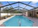 Inviting screened pool with ample deck space at 7489 Gates Cir, Spring Hill, FL 34606