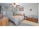 Comfortable bedroom with ceiling fan, nautical decor, and sliding glass doors at 8194 Sturbridge Ct # A, Weeki Wachee, FL 34613